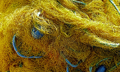 Close up shot of fishermen's net in yellow