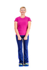 Fototapeta premium Happy and white teeth smile old senior woman in sport outfit marsala color doing fitness exercises, isolated on white background, Positive human emotions