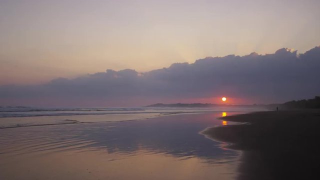 Wide shot of sunset sky over beach ocean / Esterillos, Puntarenas, Costa Rica