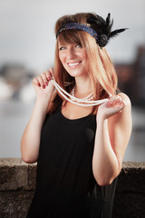 Flapper girl woman in1920s style portrait outdoor