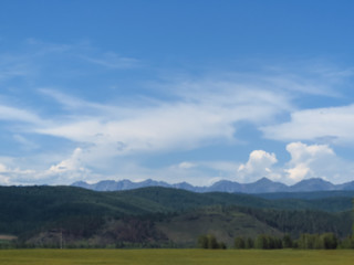 Obraz premium Rocks of mountains are seen because of hills