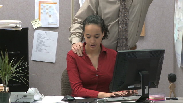 woman being sexually harassed at work