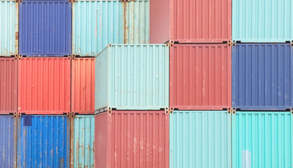 Colorful stack of container shipping at dockyard .