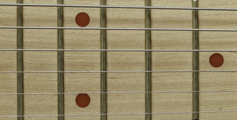 fret strings alder wood background