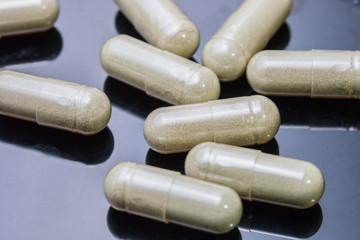 Herbal powder capsules in Cup