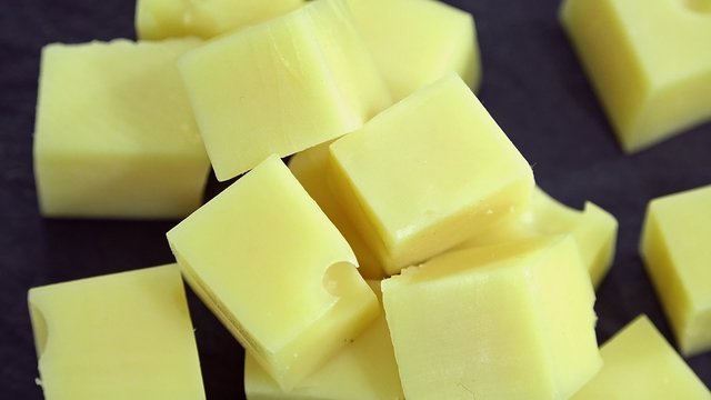 Portion of rotating Cheese (seamless loopable 4K UHD footage)
