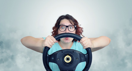 Funny woman with car wheel and smoke