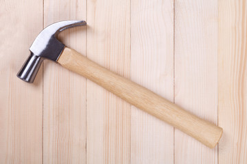 hammer on wood background