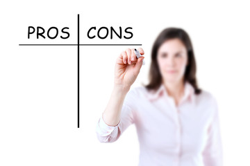 Young businesswoman holding a marker and writing pros and cons comparison concept, white background. 