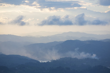 Fototapeta na wymiar Sunset and mountains at Guatape in Antioquia, Colombia
