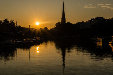 Fototapeta na wymiar Sunrise Bristol, St Mary Redcliffe, captured Floating Harbor