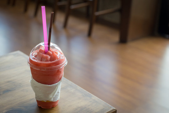 strawberry smoothie on wooden table
