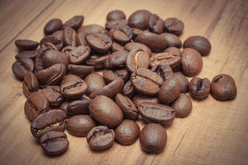 Vintage photo, Heap of coffee beans on jute canvas on table
