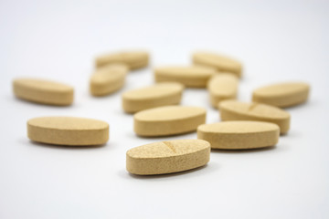 nutritional vitamin supplement pills on white background