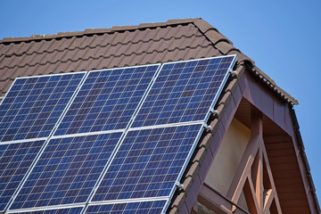 Fototapeta premium Solar panels on the roof of a house