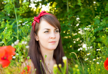 Naklejka premium Portrait of a young beautiful woman in nature