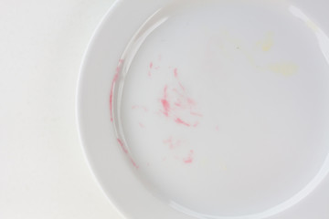 empty plate on white table after blackberry pie