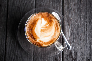 top view of coffee cup on wooden table background