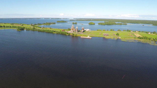 Flying over Kizhi island with old russian wooden architecture in Karelia
