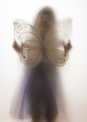 shadow of a girl behind transparent paper