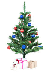 Christmas tree with baubles and gifts.