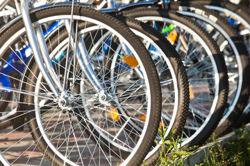 Fototapeta na wymiar Bicycle wheel closeup in the Parking lot