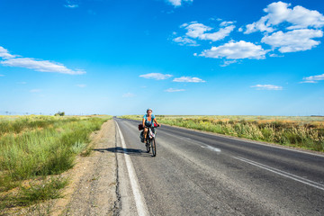 The Bicycle rider on the road.