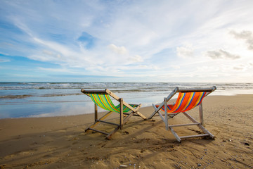 Fototapeta na wymiar Beach chair with sea and sky background