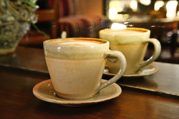 Cappuccino Coffee on Wooden table background