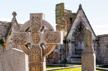 celtic cross on a graveyard in st. andrews, scotland