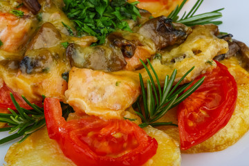 Roasted salmon with potato and tomato