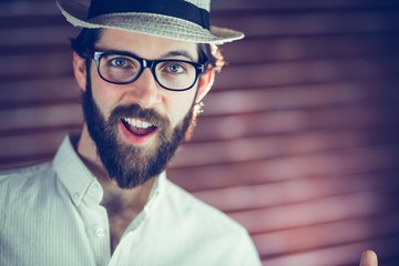 Fototapeta premium Portrait of happy man wearing hat and eyeglasses