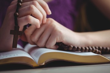 Woman praying with her bible