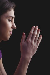 Obraz na płótnie Canvas Woman praying with hands together