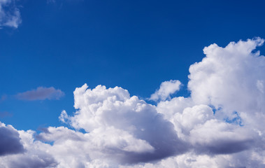 Naklejka na ściany i meble Blue sky with white clouds. Nature background.