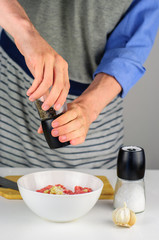Man hands making stuffing for dumplings with meat