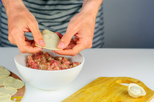 Man Hands Making Dumplings With Meat