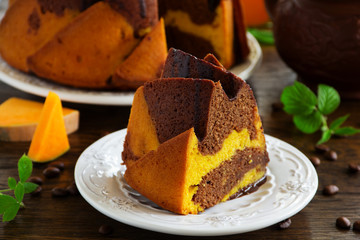 Pumpkin chocolate cake with frosting.