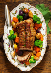Roast pork with vegetables and spices.