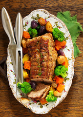 Roast pork with vegetables and spices.