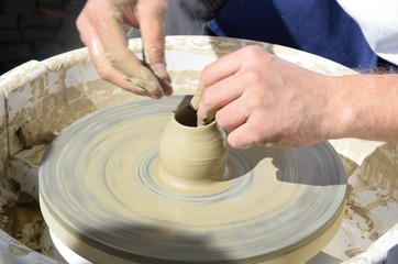 Fototapeta na wymiar Pot being made on potting wheel