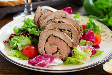 Roast beef with pesto and salad.