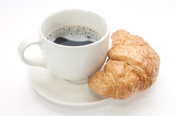 Coffee cup with a croissant isolated