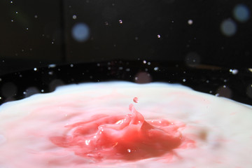 splash of syrup into milk