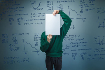 a boy of twelve European appearance in a suit holding a blank sh