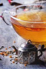 Cup of hot tea with teastrainer