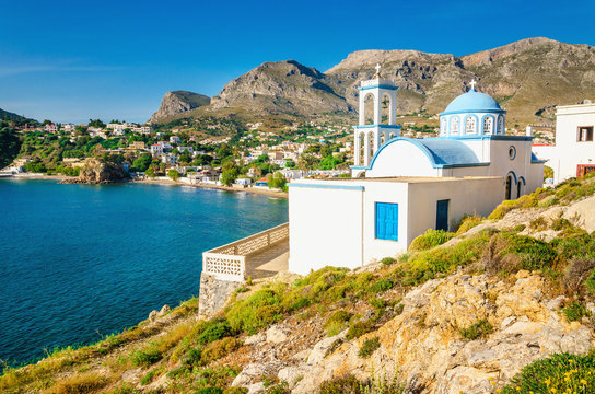 Iconic white church with blue domes, Greece