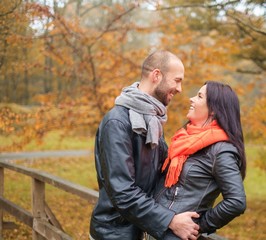 Fototapeta premium Happy middle-aged couple outdoors on beautiful autumn day