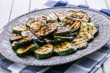 Zucchini.  Grilled zucchini. Slices of grilled zucchini on a plate. Vegetarian - Mediterranean cuisine. 