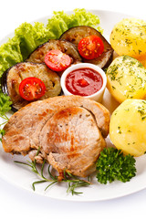 Fried steak, boiled potatoes and vegetable salad 